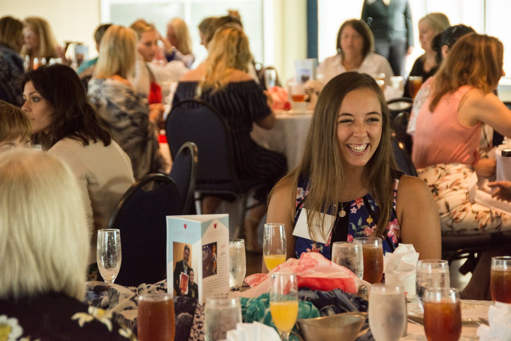 Guests chat during the luncheon